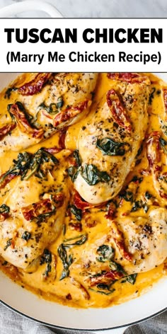 a white plate topped with chicken covered in yellow sauce and spinach on top of it