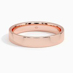 a rose gold wedding ring on a white background