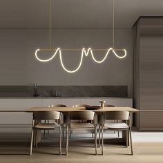 a dining room table and chairs with lights hanging from the ceiling above it in a modern style