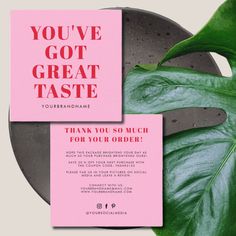 a pink card with the words you've got great taste on it next to a plant