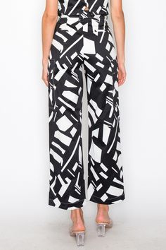 - SKU: P2125- S-M-L-The high waistband is crafted from a lightweight white fabric that contrasts beautifully with the geometric pattern, creating a visually captivating look.-The breathable and soft fabric ensures all-day comfort, making these pants suitable for various occasions.- These pants come complete with two side pockets, adding a practical element to their design without compromising on aesthetics. White High-waisted Wide Leg Pants, Modern White High-waisted Wide Leg Pants, Chic Summer Bottoms With Geometric Pattern, White Printed Wide Leg Pants, Modern Bottoms With Elastic Waistband, Modern White Trousers, Modern White Straight Pants, Chic White Printed Bottoms, Wide Leg Bottoms With Geometric Pattern For Spring