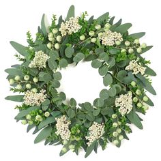 a wreath with white flowers and green leaves