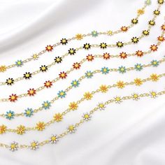 This listing is for a resizable gold plated enamel daisy chain choker made from brass, stainless steel, and gold plating. Choker is 14” with a 3.5” extension, maximum length is 17.5”. Great for layering! Available in white, yellow, blue, red, black, and multicolor. Bullet Shell Jewelry, Chokers Gold, Y2k Choker, Chain Chokers, Strawberry Necklace, Trendy Chokers, Necklace Y2k, Festival Necklace, Charm Choker Necklace