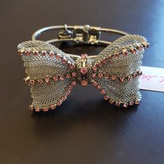 Hinged Opening, Mesh Silver-Tone Metal, And Pink Rhinestones Comprise This Fantastic Bracelet. Elegant Pink Metal Crystal Bracelet, Adjustable Crystal Bangle Bracelet For Evening, Adjustable Rhinestone Bracelets For Evening, Elegant Pink Bling Bracelets, Adjustable Rhinestone Crystal Bracelet For Evening, Lion Head Bracelet, Betsey Johnson Bracelet, Horse Bracelet, Dragonfly Bracelet