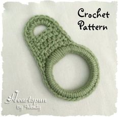 the crochet pattern is made with green yarn and has a loop at the end