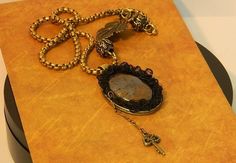 The cabochon is a natural Moroccan hematite cut in Jaipur. The chain and the om mani padme hum balls are brass. The lace with the spindle is old. By clicking on the link below, you will discover other models presented in the gallery of necklaces including brass in their composition created at the Comptoir de Féerie: https://www.etsy.com/fr/shop/comptoirdefeerie?ref=seller-platform-mcnav&section_id=24292223 Om Mani Padme Hum, Brass Chain, Jaipur, The Chain, Jewelry Necklace Pendant, Pendant Necklaces, Jewelry Necklaces, Pendant Necklace, Brass