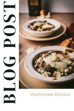 two bowls of food are sitting on a table with bread and wine in the background