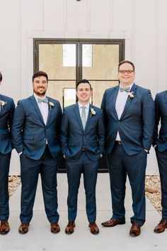 a group of men in suits standing next to each other