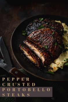 a black plate topped with meat and mashed potatoes