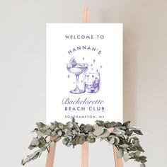 a welcome sign on top of a wooden easel