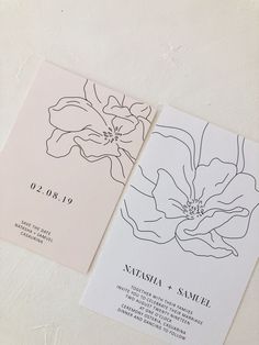 two wedding cards with black and white ink on them, one in the shape of a flower