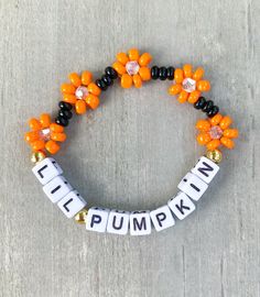 Lil Pumpkin Flower Bracelet 🎃 Perfect little Halloween gift for your lil ghoul 👻 She will love it 🧡 Made with seed beads, bicone beads and 18k gold filled beads ✨✨ CARING TIPS FOR YOUR JEWELRY ⭐️Treat and store with care. ⭐️ For longevity, avoid exposing your jewelry to water. ⭐️ Avoid having direct contact with lotions, perfumes, sanitizers as these chemicals may cause discoloration of your jewelry. Bead Pumpkin, Pumpkin Bracelet, Stacked Beaded Bracelets, Holiday Bracelets, Bracelet Inspired, Halloween Flowers, Halloween Bracelet, Pumpkin Flower, Halloween Beads