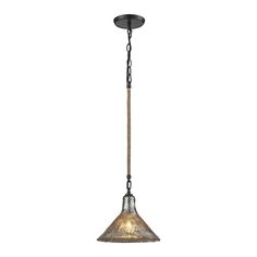 an old fashioned pendant light hanging from the ceiling