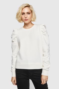 Our best-selling Janine Sweatshirt has a subtle feminine feel thanks to its low-key statement ruffled sleeves. We love wearing this casual-cool top with everything from jeans to leather skirts. | Rebecca Minkoff Janine Sweatshirt In White - Size XS Trendy Relaxed Fit Puff Sleeve Top For Work, Relaxed Fit Blouson Sleeves Tops For Fall, Chic Tops With Ribbed Cuffs For Fall, Chic Relaxed Fit Sweatshirt For Layering, Chic Relaxed Fit Crew Neck Puff Sleeve Top, Chic Relaxed Fit Puff Sleeve Top With Crew Neck, Chic Cotton Crew Neck Sweatshirt, Chic Spring Sweatshirt For Layering, Trendy Relaxed Fit Top With Ruffle Sleeves