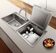 a stainless steel sink and dishwasher in a kitchen