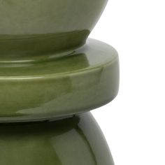 two green vases stacked on top of each other