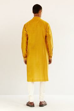 Mustard yellow chanderi kurta with an embroidered yoke. Comes with churidar.
Component: 2
Pattern: Embroidery
Type Of Work: Abstract
Neckline: Mandarin
Sleeve Type: Long sleeves
Fabric: Chanderi
Color: Yellow
Other Details: 
Abstract embroidery
Occasion: Mehendi and Puja - Aza Fashions Gold Silk Churidar With Long Sleeves, Yellow Raw Silk Kurta With Dabka Detailing, Yellow Raw Silk Kurta With Dabka, Yellow Dabka Raw Silk Kurta, Yellow Dabka Churidar For Eid, Gold Traditional Wear With Dabka On Cotton Silk, Gold Long Sleeve Slub Silk Kurta, Mustard Resham Embroidery Kurta For Eid, Yellow Churidar With Dabka For Navratri