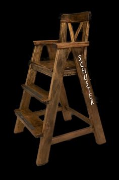 an old wooden step stool with the word schwafer on it's side