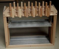 a wooden rack with several knives on it and some wire in the bottom shelf for storage