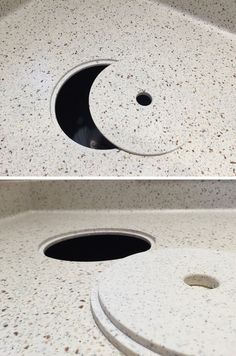 there is a hole in the counter that looks like it has a crescent on it