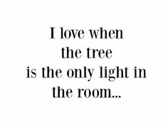 a black and white photo with the words i love when the tree is the only light in the room