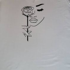 a white shirt with a drawing of a woman's face