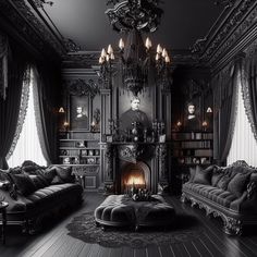 an ornate living room with black furniture and chandelier