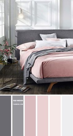 a bedroom with pink and grey colors in the walls, bedding and pillows on the floor