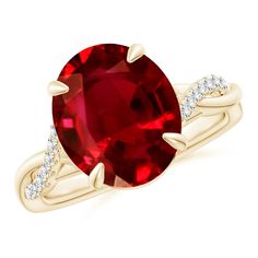 a red ring with diamonds on the sides and an oval shaped stone in the middle