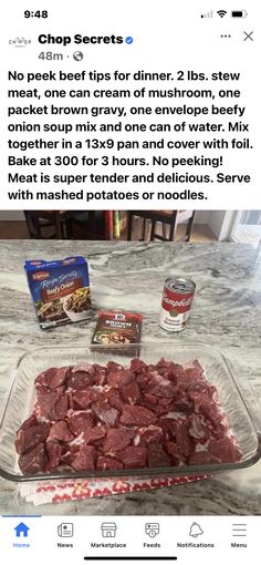 a glass dish filled with meat sitting on top of a counter