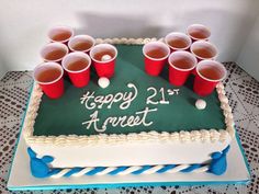 a birthday cake with cups on it