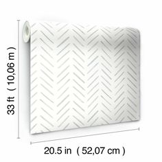 a white wallpaper with an arrow pattern on it and measurements for the width of the wall