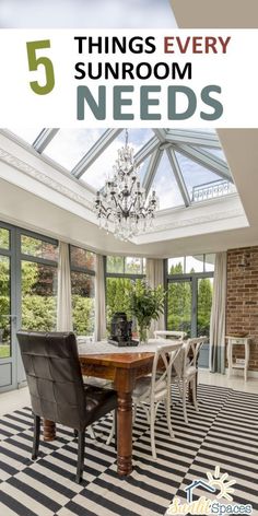 a dining room table with chairs and a chandelier in the middle of it