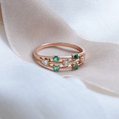 Make your day with our emerald & diamond ring! It's perfect for an engagement ring, wedding or anniversary ring. Natural emerald engagement ring is made of solid gold in a unique and delicate style. Choose your color of gold and ring size from the drop down menu. If you are looking to make this piece even more custom and special, feel free to contact me! We will find a way to make something specially for you.✨ DIAMOND DETAILS QUANTITY 3ps MEASUREMENTS 2.5mm CLARITY GRADE SI COLOR GRADE G GEM Green Diamond Stackable Rings For May Birthstone, Anniversary Stackable Emerald Rings With Round Band, Anniversary Emerald Stackable Rings, Emerald Solitaire Stackable Rings For Anniversary, Emerald Solitaire Diamond Ring For Anniversary, Emerald Diamond Ring For Anniversary, Anniversary Emerald Stackable Rings With Round Band, Promise Emerald Ring With Round Cut For May Birthstone, Emerald Cut May Birthstone Ring For Anniversary