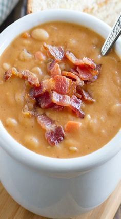 a white bowl filled with soup and bacon