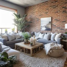 a living room filled with furniture and a brick wall