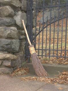 a broom leaning against a gate with the words, one who's home