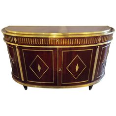 an ornately designed console table with gold trimmings and diamond designs on the top