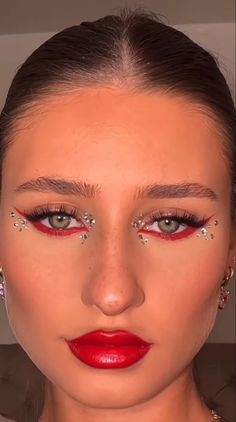 Rebelde Concert Makeup, Red Bedazzled Makeup, Red Eyeliner With Gems, Red Cheer Makeup, Red Inspired Makeup Looks, Ferrari Makeup Look, Red Eye Makeup Gems, Red Album Makeup, Rbd Inspired Makeup