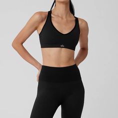 Seamless Ribbed Favorite Bra - Black | Alo Yoga Compressive Bra-friendly Alo Yoga Activewear, Athleisure Stretch Bra With Adjustable Straps, Fitted Bra With Adjustable Straps For Pilates, Adjustable Straps Bra For Pilates, Athleisure Bra With Adjustable Straps, Stretch Sports Bra With Removable Pads And Strappy Back, Fitted Alo Yoga Sports Bra With Built-in Bra, Fitted Seamless Alo Yoga Sports Bra, Strappy Back Sports Bra With Removable Pads