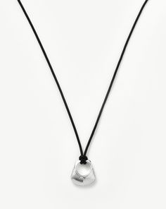 Hera Ridge Pendant Cord Necklace | Silver Plated. A Capsule of Sculptural Modern-Day Amulets. This Statement Silver Pendant Cord Necklace Features Geometric Ridge Detailing and a Pyramid Profile. Textures and Geometric Patterns Combine to Signify Intuition, Inner Knowing, and Creativity. The Cord Can be Tied at Any Length, Doubled Up as a Choker, or Worn Long — Your New Everyday Staple. Silver Plated on Recycled Sterling Silver Pendant Dimensions: 24mm X 23. 5mm Length: 800mm Weight: 12g Product Inner Knowing, Mens Diamond Bracelet, Diamond Initial Necklace, Jewelry Staples, Cord Jewelry, Coin Pendant Necklace, Diamond Gift, Gold Gifts, Engraved Bracelet