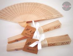 three wooden fan shaped tags tied to each other