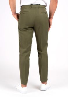 Crafted from a luxurious custom cotton blend, the Olive Cotton Pants offer a refined yet versatile look. These elegant trousers boast a timeless olive hue that will never go out of style. Effortlessly elevate any outfit with these sophisticated premium pants. Elegant Green Bottoms With Welt Pockets, Chic Olive Trousers, Classic Green Workwear Chinos, Green Fitted Classic Chinos, Classic Green Fitted Chinos, Classic Fitted Green Chinos, Classic Green Chinos For Workwear, Chic Olive Pants For Work, Chic Olive Pants For Workwear