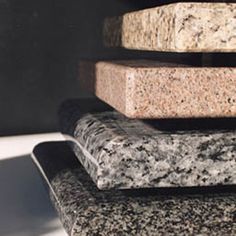 four different types of granite stacked on top of each other in the same room,