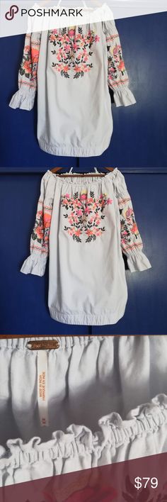 Free People Embroidered Dress - New NWOT Off the shoulder long sleeve embroidered cotton dress. Muted baby blue color with cream, fluorescent orange, and fluorescent pink flowers. Long puff sleeve with ruffle at the wrist. Features a wide hem and two side pockets on this slip on mini. Elastic at neck, shoulders, and wrist.  Note - some embroidery missing on the left sleeve stripe Free People Dresses Mini Baby Blue Colour, Long Puff Sleeves, Free People Dress, Embroidered Dress, Cotton Dresses, New Dress, Blue Color, Plus Fashion, Mini Dress