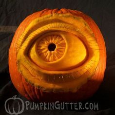 a carved pumpkin with an eye on it