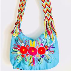 Mexican Bag Embroidered Boho Chic Indie Messenger Crossbody Color: Turquoise And Colorful Indigenous Hand Embroidery Loomed Handmade Colorful Belt High Quality Seams Closes With A Zipper. Comfortable Wide Strap, Which Is Perfect For Traveling A Roatrip, A Holiday Day At The Beach, Books, Colors, Notebook, Water, Food, Very Spacious And Useful From Groceries To A Laptop, Pieces Are Handmade And Color Unique Embroidering Adds To The Unique Beauty Of Garment. Handmade With Love, Aida Coronado Embroidered Multicolor Shoulder Bag For Vacation, Handmade Blue Shoulder Bag For Festivals, Traditional Bags With Floral Embroidery, Festival Multicolor Embroidered Hobo Bag, Turquoise Bags For Festivals, Multicolor Embroidery Shoulder Bag For Beach, Bohemian Embroidered Summer Bags, Blue Embroidered Summer Shoulder Bag, Summer Blue Embroidered Shoulder Bag