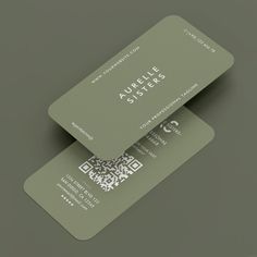 two green business cards with qr code printed on the front and back, sitting side by side