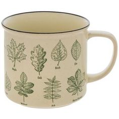 a coffee mug with different types of leaves on it