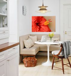 a living room with white walls and wooden floors